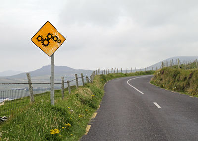 Winding road and yellow road sign - processes and change