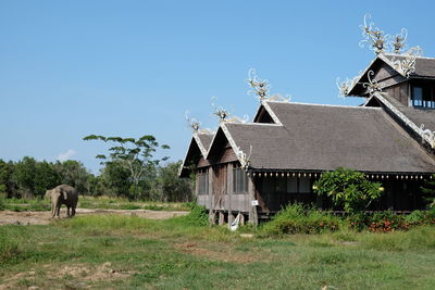 View of building on field against sky