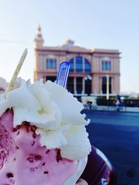 Close-up of ice cream against built structure