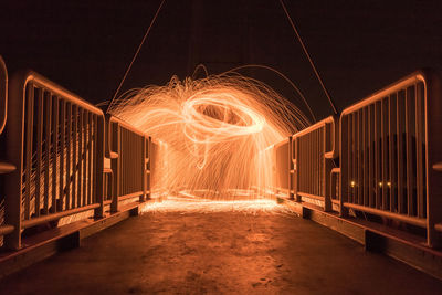 Illuminated footbridge at night