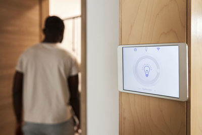 Smart home lighting system on tablet pc mounted on wall