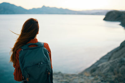 Rear view of woman looking at sea