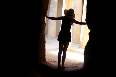 Silhouette couple standing in front of woman