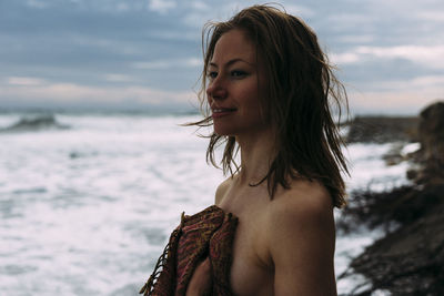 Shirtless woman at beach