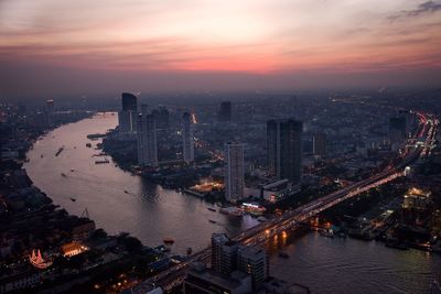 High angle view of river amidst buildings in city