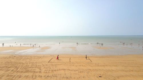 Scenic view of beach against clear sky