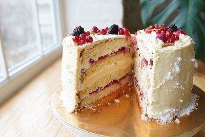 Fruit cake staying on the wood on the window sill