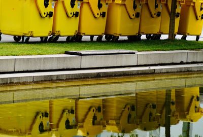 Close-up of yellow train in row