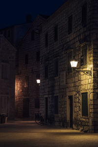 Low angle view of illuminated building at night