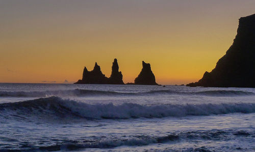 Scenic view of sea against clear sky during sunset