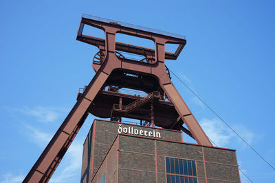 Low angle view of built structure against blue sky