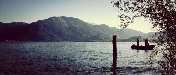 Scenic view of lake with mountains in background