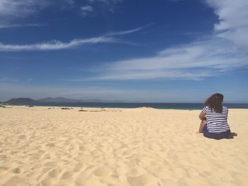 Rear view of man on beach