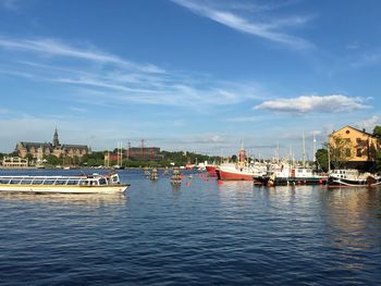 Boats moored at harbor