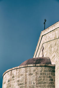 Low angle view of building against blue sky