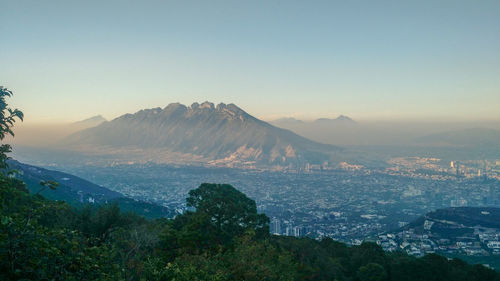 Scenic view of mountains against sky at sunset