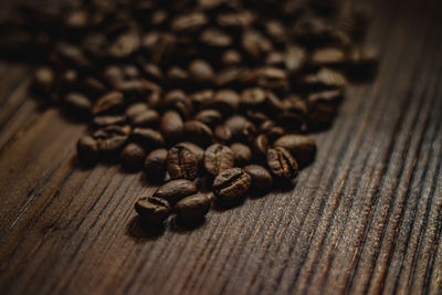 Close-up of roasted coffee beans on table