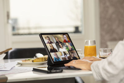 Person having video call on digital tablet