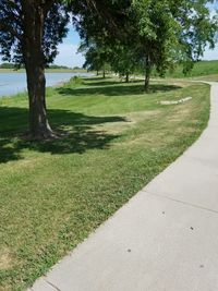 Scenic view of golf course against sky