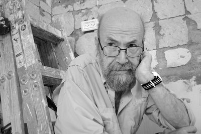 Portrait of senior man smoking cigarette