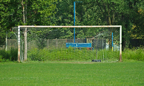 View of soccer field against trees