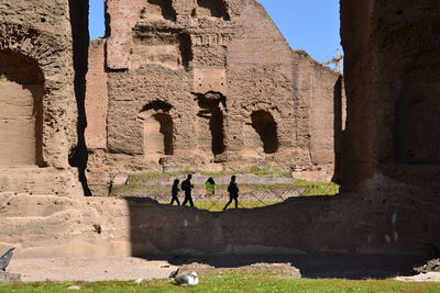 People on old ruins