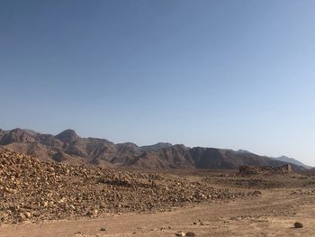 Scenic view of arid landscape against clear sky