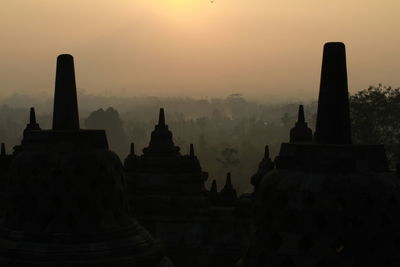 Silhouette of temple building at sunrise