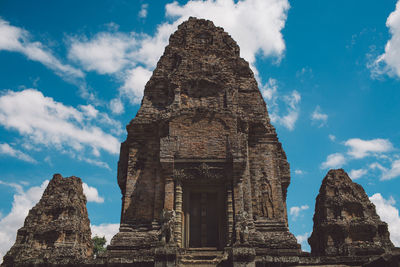 Low angle view of historic temple against sky