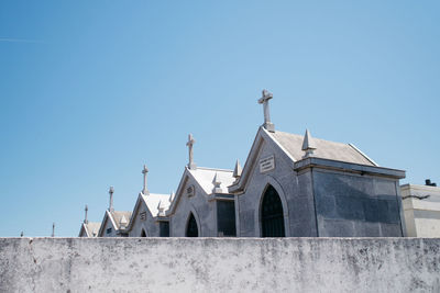 Low angle view of church against blue sky