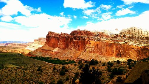 Low angle view of rock formation against blue sky