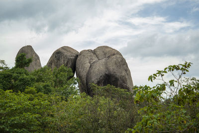 Low angle view of rock formations against sky