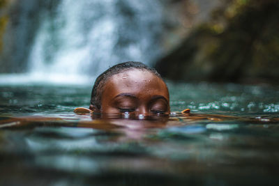 Close-up portrait of man swimming in water