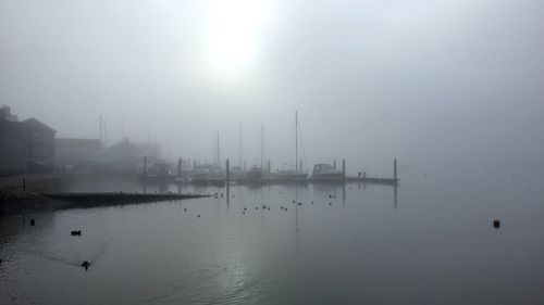 Scenic view of sea against sky during foggy weather