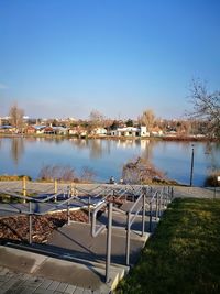 Scenic view of lake against clear blue sky