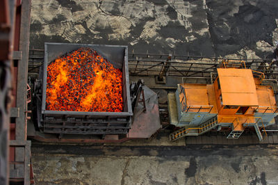 High angle view of engine on tracks at factory