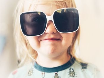 Close-up portrait of boy wearing sunglasses