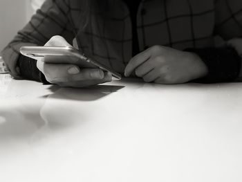 Close-up of man using smart phone