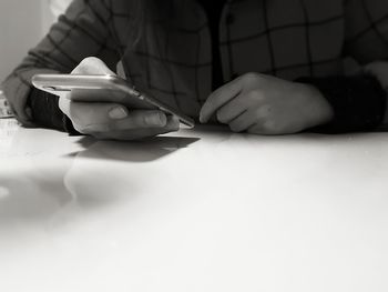 Close-up of man using smart phone