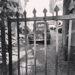 Panoramic view of lake seen through fence