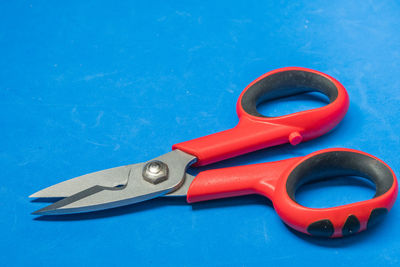 High angle view of metallic equipment on blue table