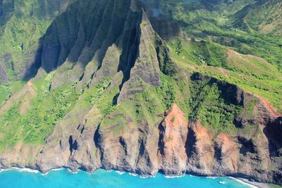 High angle view of sea and mountains during sunny day