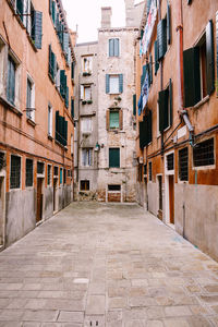 Footpath amidst buildings in town