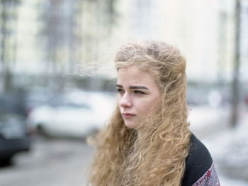 Young woman standing outdoors during winter