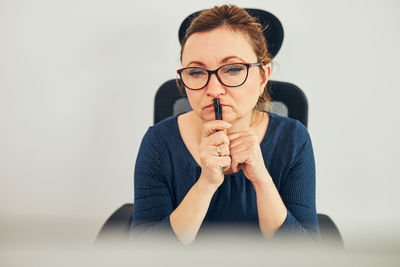 Woman entrepreneur focused on solving difficult work. confused woman thinking hard looking at screen