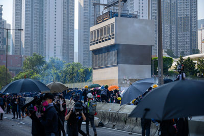 Group of people on wet street in rainy season