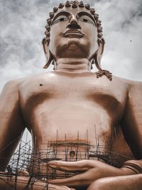 Low angle view of statue against sky