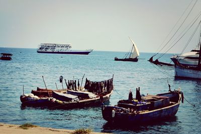 Boats moored in sea