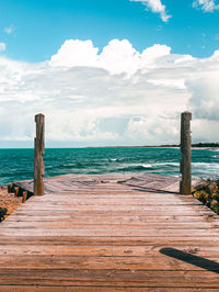 Peaceful wooden bridge on the coast with nice views to the beach and sky from puerto rico