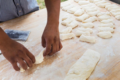 High angle view of man preparing food on table